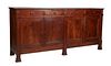 Unusual Large French Provincial Louis Philippe Carved Cherry Sideboard, the rectangular rounded edge top over four setback frieze drawers above four c