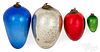 Four Kugel egg Christmas ornaments