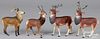 Four composition reindeer candy containers