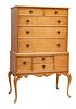 AMERICAN CARVED TIGER MAPLE HIGHBOY, 20TH C., H 60", W 35.75", D 21.5" 