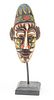 INDONESIAN CARVED WOOD AND POLYCHROME MASK, 20TH C., H 9", W 4.5" 