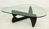 ISAMU NOGUCHI BY VITRA AG, WEIL/RHINE WOOD, PAINTED BLACK AND CLEAR GLASS COFFEE TABLE H 15.5" W 36.75" L 50.5" 
