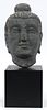 CARVED BASALT BUDDHA HEAD, C. 1900, H 10 1/2", W 6", D 6" (HEAD) 