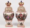 PAIR OF CONTINENTAL PORCELAIN CAPPED URNS