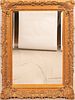 LOUIS XIV STYLE CARVED WOOD AND COMPOSITE GILT MIRROR, H 62", W 50"