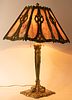 BRADLEY & HUBBARD SLAG GLASS TABLE LAMP, WITH GILT BRONZE PATINATED FRAME AND BASE C 1910, H 24" DIA 18.5" 