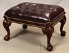 CHIPPENDALE STYLE BURGUNDY LEATHER AND MAHOGANY FOOT STOOL H 17" W 29" 