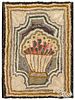 American hooked rug with vase of flowers