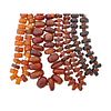 FOUR STRANDS OF ANTIQUE AMBER BEADS