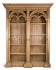 A Continental Neo-Gothic Carved Pine Bookcase Height 100 1/2 x width 78 x depth 21 inches.