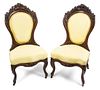 A Pair of Rococo Revival Laminated Rosewood Parlor Chairs Height 36 1/2 inches.