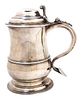 A George III Silver Covered Tankard, Thomas Whipham, London, 1748, of baluster form with a domed lid and raised on a stepped 