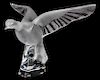 A Lalique Molded and Frosted Glass Figure of a Bird Height 11 3/4 inches.