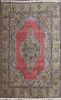 A GOOD ROOM SIZED HAND WOVEN ORIENTAL CARPET