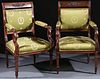 A PAIR OF FRENCH EMPIRE CARVED WALNUT ARM CHAIRS
