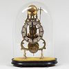 English Brass Skeleton Clock and a Glass Dome