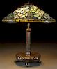 TIFFANY STUDIOS “BLUE CLEMATIS” FAVRILE GLASS AND BRONZE TABLE LAMP