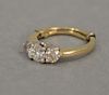 Diamond and gold ring having approximately 1/2ct center diamond with approximately 1/4ct diamond on each side.