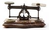 * A Brass and Walnut Postage Scale, Width 8 1/4 inches.