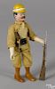 Schoenhut painted wood Teddy Roosevelt with his hat, pistol, and rifle, 8'' h.