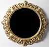 A Continental Giltwood Mirror, Diameter 28 inches.