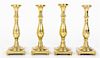A Set of Four English Brass Candlesticks, Height 9 5/8 inches.