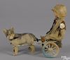 German painted tin and composition clockwork dog cart with a doll, label inscribed Muschi