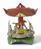 Meier tin lithograph carousel penny toy with children riding horses, 2 1/2'' h.
