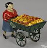French painted composition and tin clockwork lady orange cart vendor, 6 1/2'' h.