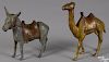 Two A. C. Williams painted cast iron still banks, to include a camel, 7 1/4'' h., and a donkey