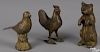 Three painted cast iron still banks, to include a begging bear, 5 3/8'' h., a rooster, 5'' h.