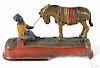J. & E. Stevens cast iron Always did 'spise a mule mechanical bank with boy on bench, 6'' h.