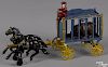 Hubley cast iron horse drawn Royal Circus cage wagon with a bear and a driver, 15 3/4'' l.