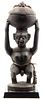 An African Carved Hard Wood Figural Vessel, Height 26 1/4 inches.
