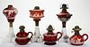 ASSORTED RUBY-STAINED GLASS KEROSENE LAMPS, LOT OF SIX,