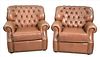 A Pair of Brown Leather Upholstered Easy Chairs