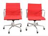 Two Red Eames Aluminum Group Chairs