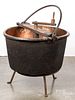 Copper apple butter kettle on stand