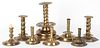 Eight embossed and engraved brass candlesticks