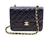* A Chanel Navy Quilted Flap Handbag, 8" x 6" x 2".