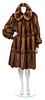 * A Fendi Brown Wild Mink Coat, Size 40.