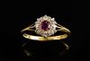 Edwardian ruby and diamond cluster ring in 18 ct yellow gold.