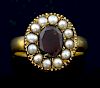 A Victorian garnet and pearl ring in unmarked gold