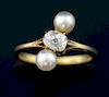 Pearl and diamond three stone ring, with central old cut diamond of 0.30 carat in 18 ct gold