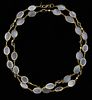 Contemporary  gold necklace of oval cabochon moonstones and faceted round sapphires, set in 18 ct gold