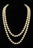 A single row of one hundred and seven cultured pearls measuring 7 mm , strung knotted. Length With original receipt from Harr