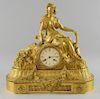 Charles Frodsham gilt metal mantel clock in the form of a reclining female figure in classic dress on plinth base decorated w