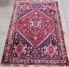 Persian blue ground rug the centre with a lozenge shaped medallion 172cm x 124cm