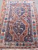 Persian blue ground rug multiple boarders centre with two stepped lozenge shaped medallions 68cm x 111cm