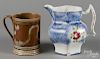 Blue spatter pitcher with Adam's rose decoration, 7'' h., together with a mocha mug, 5 3/4'' h.